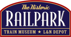 Logo for The Historic Railpark Train Museum & L&N Depot featuring white and gold text on a blue background.